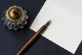 Fountain pen, inkwell, letter on a black background Royalty Free Stock Photo