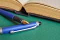 The fountain pen is lying on the open book. Close up Royalty Free Stock Photo