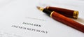 The fountain pen is lying on the paper. Close up. Macro Royalty Free Stock Photo