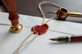 Fountain pen and old notarial wax seal on document, closeup Royalty Free Stock Photo