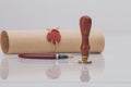 Fountain pen and old notarial wax seal on