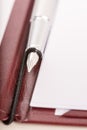 Fountain pen on an open executive leather folder Royalty Free Stock Photo