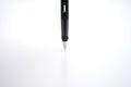 Fountain pen placed on the white paper opaque. Communication to business transactions, education, work, suitable as a background Royalty Free Stock Photo