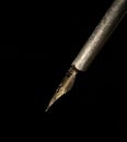 Fountain pen with pen pointing down on black backgroundground Royalty Free Stock Photo