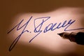 Fountain pen signature on a letter Royalty Free Stock Photo