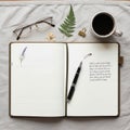 Fountain pen with silver accents rests on the right page, over Royalty Free Stock Photo