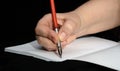 Fountain pen with steel pen in a female hand. Royalty Free Stock Photo