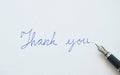 Fountain pen write thank you word on white background Royalty Free Stock Photo