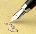 Fountain pen writing on the paper, Royalty Free Stock Photo