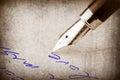 Fountain pen writing on the paper, Royalty Free Stock Photo