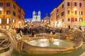 Fountain on the Piazza di Spagna square and the Spanish Steps in Rome at dusk, Italy Royalty Free Stock Photo