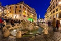 Fountain on the Piazza di Spagna square and the Spanish Steps in Rome at dusk, Italy Royalty Free Stock Photo