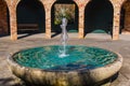 Fountain with pillars in the back gorund