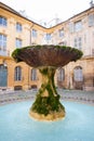 Fountain in Place d`Albertas in Aix-en-Provence, France, in a sunny day