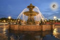 Fountain at the Place de la Concorde in Paris by night (with the moon), France Royalty Free Stock Photo