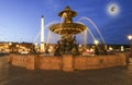 Fountain at the Place de la Concorde in Paris by night (with the moon), France Royalty Free Stock Photo