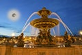 Fountain at the Place de la Concorde in Paris by night (with the moon), France Royalty Free Stock Photo