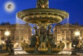 Fountain at the Place de la Concorde in Paris by night (with the moon), France Royalty Free Stock Photo