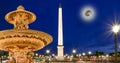 Fountain at the Place de la Concorde in Paris by night (with the moon), France Royalty Free Stock Photo