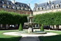 Fountain at Place des Vosges. Paris. France. Royalty Free Stock Photo