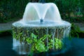 Fountain pond in a shady garden Royalty Free Stock Photo