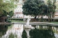 Fountain or pond with statue in Lisbon. Landscaping or architecture or park and garden. Antique statue in water or