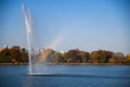 Fountain and rainbow at the Central Park Reservoir or Jacqueline Kennedy Onassis Reservoir in New York city during the autumn seas Royalty Free Stock Photo