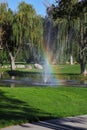 The fountain and  rainbow on the golf course Royalty Free Stock Photo