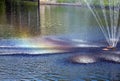 Fountain on the river. Rainbow around the jets. Riga, Latvia Royalty Free Stock Photo