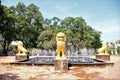 Fountain in the royal gardens in siem reap cambodia with gold lion stautes Royalty Free Stock Photo