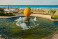 Fountain with a sculpture of apricot fruit and sea view. Alanya, Antalya district, Turkey, Asia