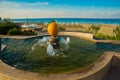 Fountain with a sculpture of apricot fruit and sea view. Alanya, Antalya district, Turkey, Asia