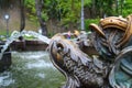 A fountain in the shape of a fish in the park, a fountain in the park on a summer day. Royalty Free Stock Photo