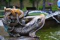 A fountain in the shape of a fish in the park, a fountain in the park on a summer day. Royalty Free Stock Photo