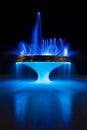 Illuminated Fountain at Night With Electric Blue Reflections Royalty Free Stock Photo