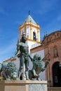 Fountain showing Hercules taming lions with the Socorro Parish church to the rear, Ronda, Spain.