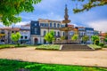 Fountain in small park and typical colorful buildings houses on Campo das Hortas square in Braga city Royalty Free Stock Photo