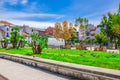 Fountain in small park and typical colorful buildings houses on Praca Conde Agrolongo square in Braga city Royalty Free Stock Photo