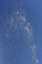 Fountain splashing against blue sky Royalty Free Stock Photo