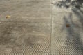 Fountain in the square lined with a mosaic of tiles. through a science terrace or bridge made of metal stainless steel slats. the Royalty Free Stock Photo