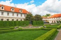 A fountain with a statue and blooming chestnut trees in Wallenstein Garden Valdstejnska Zahrada, Prague, Czech Republic. Royalty Free Stock Photo