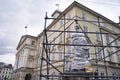 Fountain with a Statue of Diana on Rynok Square protected by metal construction and wrapping to avoid destruction and