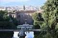 Fountain with statue of Neptune in the foreground and beyond Palazzo Pitti, in the distance a part of Florence. Royalty Free Stock Photo