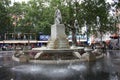 Fountain with a statue in one of the largest squares with a garden in Soho, in the English capital