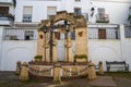 Fountain and statues of the Spanish Inquisition in the historic city center of Arcos de la Frontera