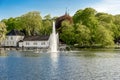 A fountain and Stavanger Cathedral school at Byparken park in Stavanger city downtown