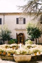 Fountain surrounded by flowerpots in front of the Medici Villa of Lilliano Wine Estate in Tuscany, Italy. Royalty Free Stock Photo