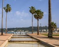 Fountain surrounded by umbrella palm trees in Le Square Albert 1ER in Antibes, France