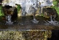 Fountain with three jets of water and basin illuminated by the morning sun which is located at the entrance to the hermitage of Ca Royalty Free Stock Photo