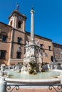 Fountain and town hall in the square of Tarquinia Royalty Free Stock Photo